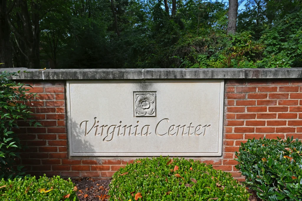 Virginia Center community sign set in a brick entrance wall in Vienna VA