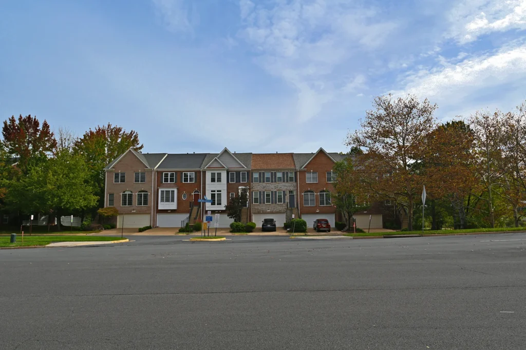 Townhouses set back across a wide street in Virginia Center, Vienna VA