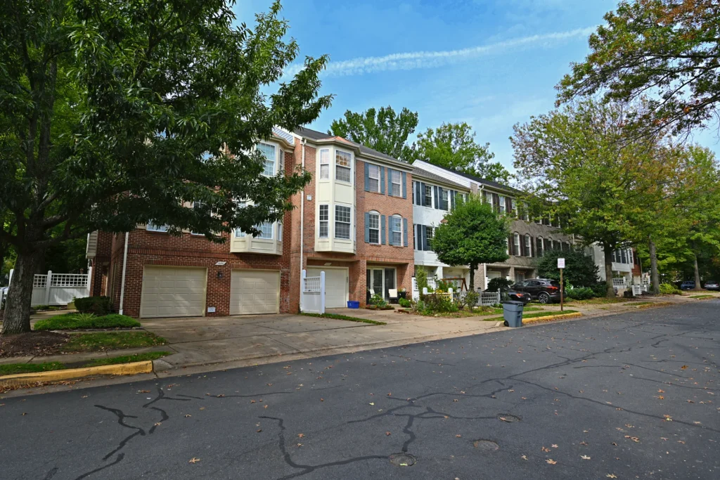 Townhouses with bay windows and front-entry garages on a Virginia Center street in Vienna VA