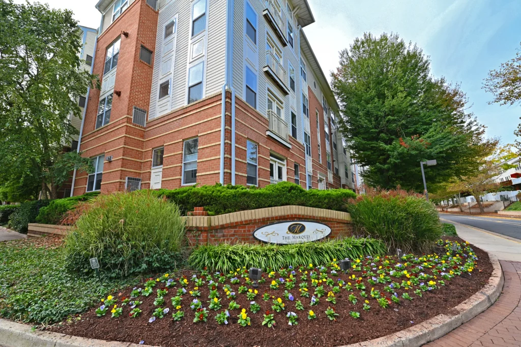 Landscaped entrance and sign of the Marquis at Vienna Station condominium in Virginia Center, Vienna VA