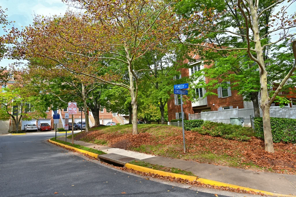Pembsly Drive and Centerboro Court street signs beside brick townhouses under mature trees in Virginia Center, Vienna VA